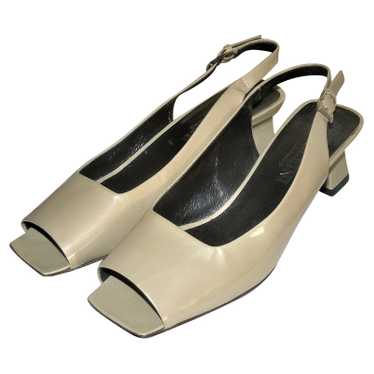 Pollini Pumps/Peeptoes Patent leather in Beige - image 1